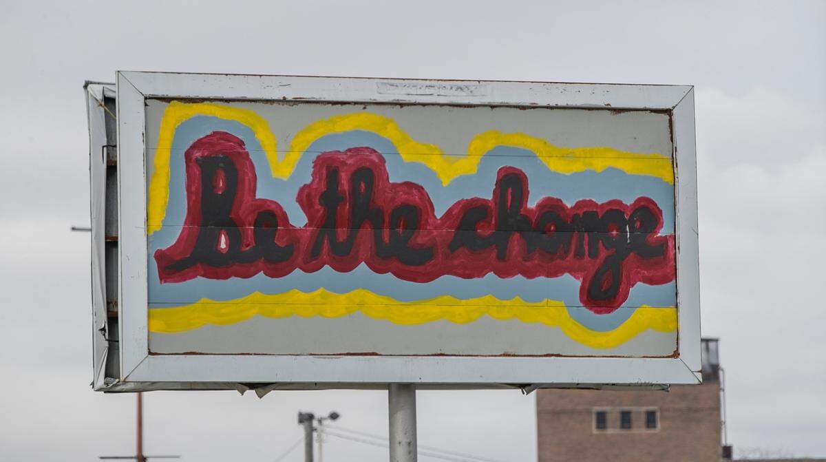 Members of Clean City Coalition have painted many abandoned signs in East St. Louis. The group is bringing residents together to clean up the city.