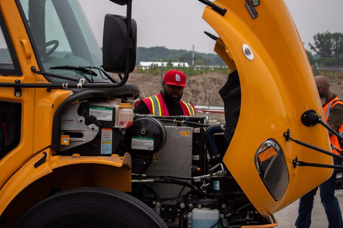 Arnandez Washington peeks under the hood of East St. Louis District 189’s new electric school bus on Thursday, June 12, 2025. The new school bus’ electric engine keeps quiet as it drives down the road, reaching a roar no louder than a regular car once it hits high speeds.