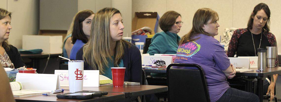 Attendees listen at the Youth Mental Health First Aid seminar, a training for teachers and school employees on issues specific to teens and how best to handle them, at the St. Clair County Regional Office of Education in Belleville.