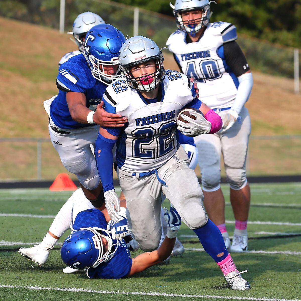 Freeburg’s Tanner Little carries the ball during the first round IHSA Class 4A playoff game between the Midgets and Columbia Saturday.