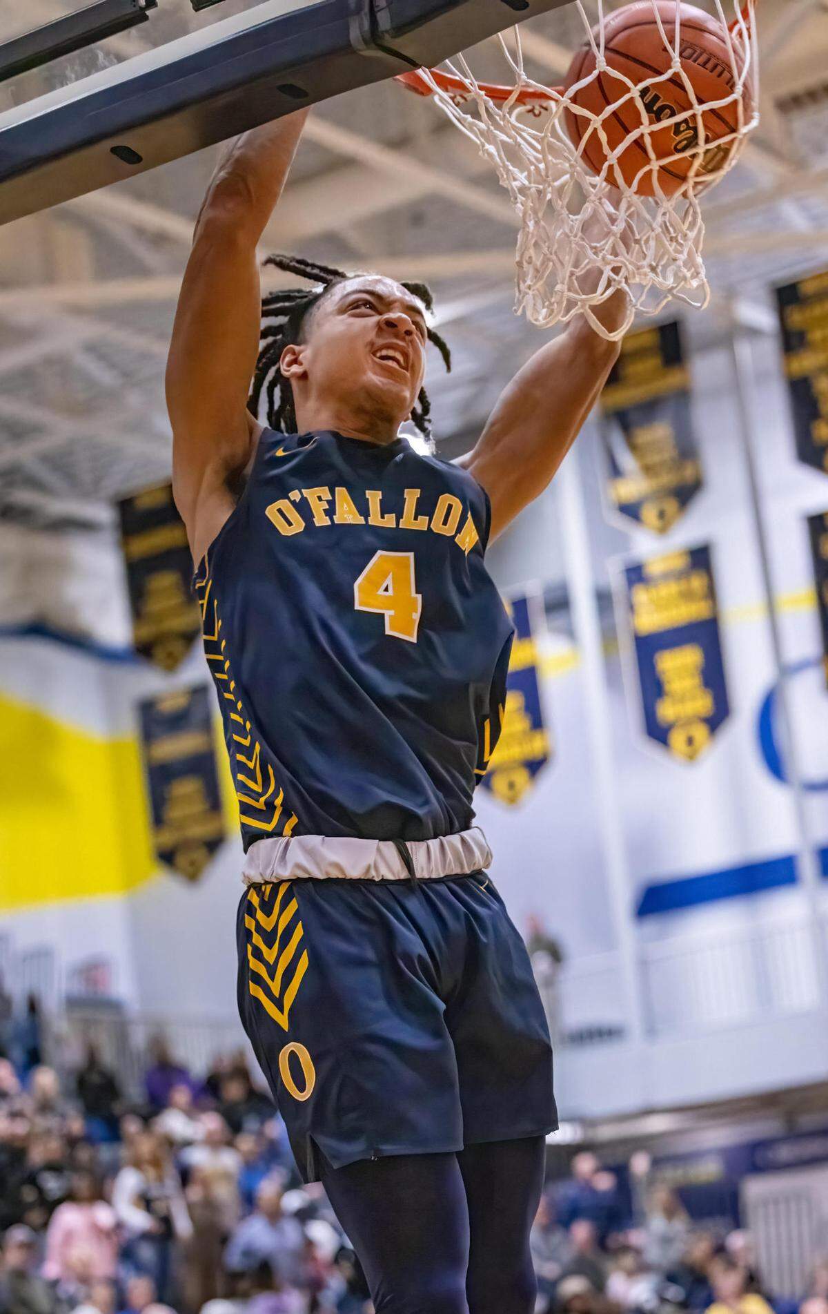 O’Fallon’s Jalen Smith dunks the ball during Friday night’s IHSA Class 4A regional championship game. The Panthers ultimately prevailed 52-50.