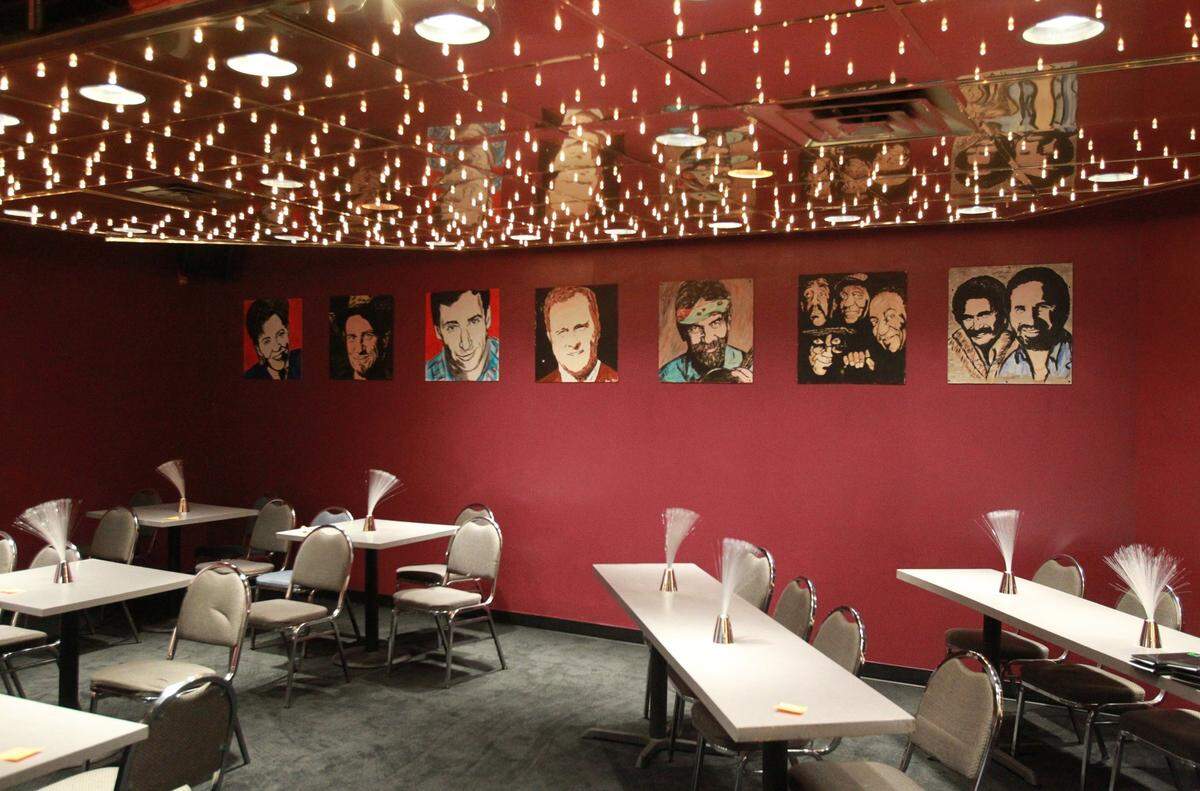 Seating inside the Hey Guys Comedy Club. The comedy club closed after four years in business.