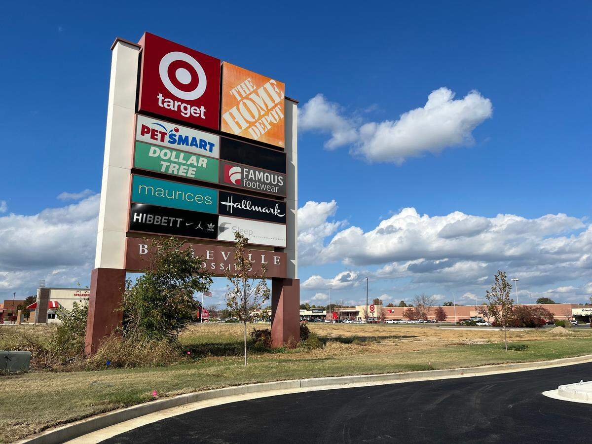 In this 2023 file photo, overgrown weeds and a scraggly tree surround a giant pylon sign for Belleville Crossing, northeast of the intersection of Illinois 15 and Frank Scott Parkway.