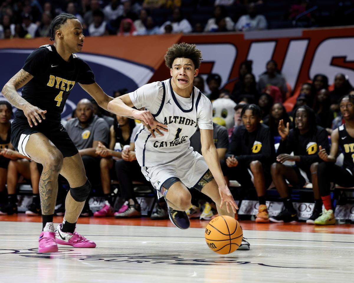 March 15, 2025 - , - Belleville Althoff’s Bryden Gryzmala drives to the basket during the IHSA, 2A championship game against Chicago (Dyett) at the State Farm Center in Champaign. [Photo: Chris Johns]