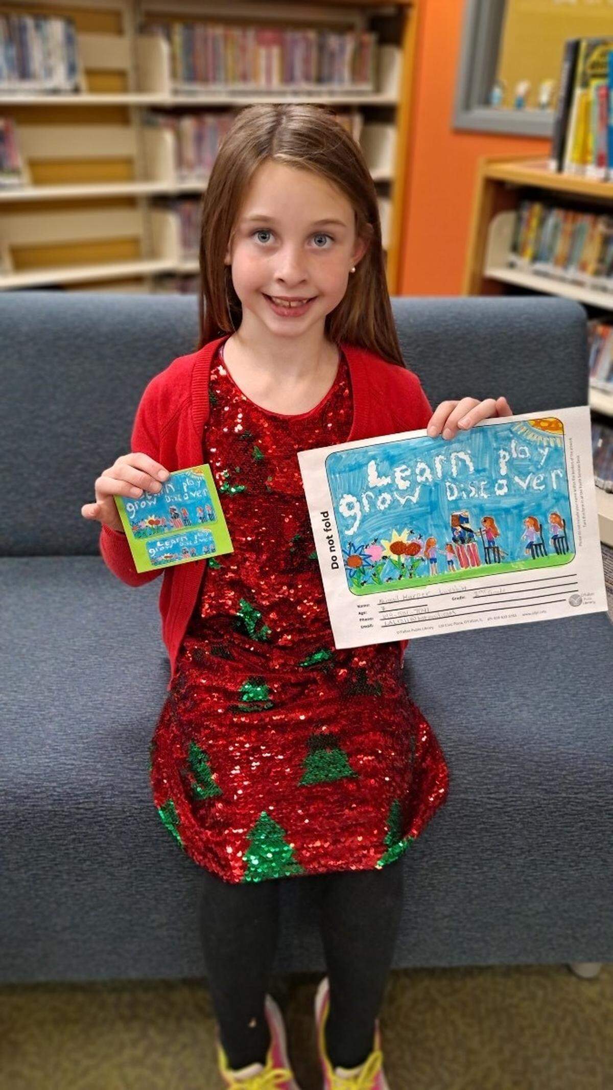 Pictured is Abigail, the winner of the “design a library card for kids” contest the O’Fallon Public Library recently held. Her design was chosen for the new card.