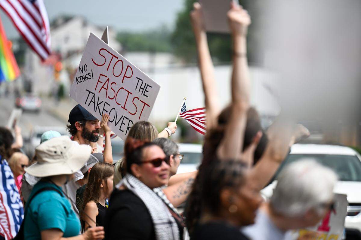 Protesters rally against President Donald Trump at the “No Kings” protest in Belleville’s Public Square Saturday, June 14, 2025.