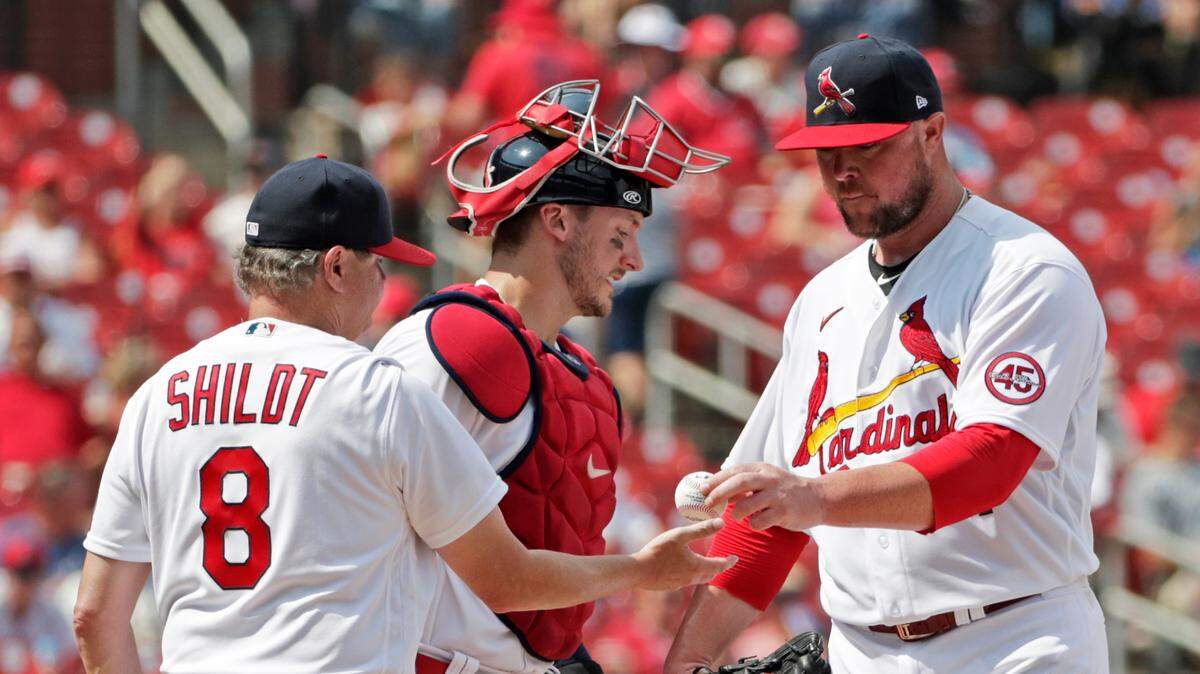 St. Louis Cardinals starting pitcher Jon Lester, right, hands the ball to manager Mike Shildt (8) as he is relieved and catcher Andrew Knizner looks on in the sixth inning of a baseball game against the Kansas City Royals in early August. Lester and fellow newcomer J.A. Happ will be key to the Cardinals’ last-ditch run at a wild card playoff spot.