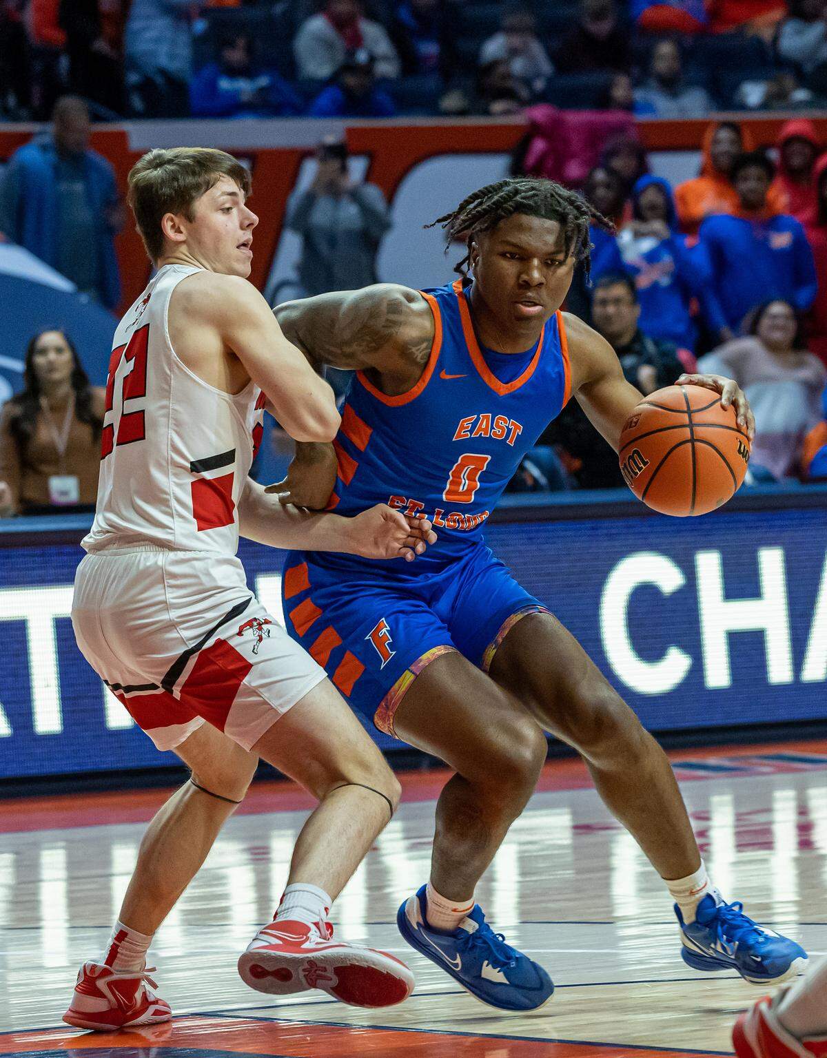 East St. Louis’ Macaleab Rich drives to the basket during Friday’s IHSA Class 3A state semifinal game against Metamora at State Farm Center in Champaign on the campus of the University of Illinois. The Flyers ultimately fell to the Redbirds 50-43.