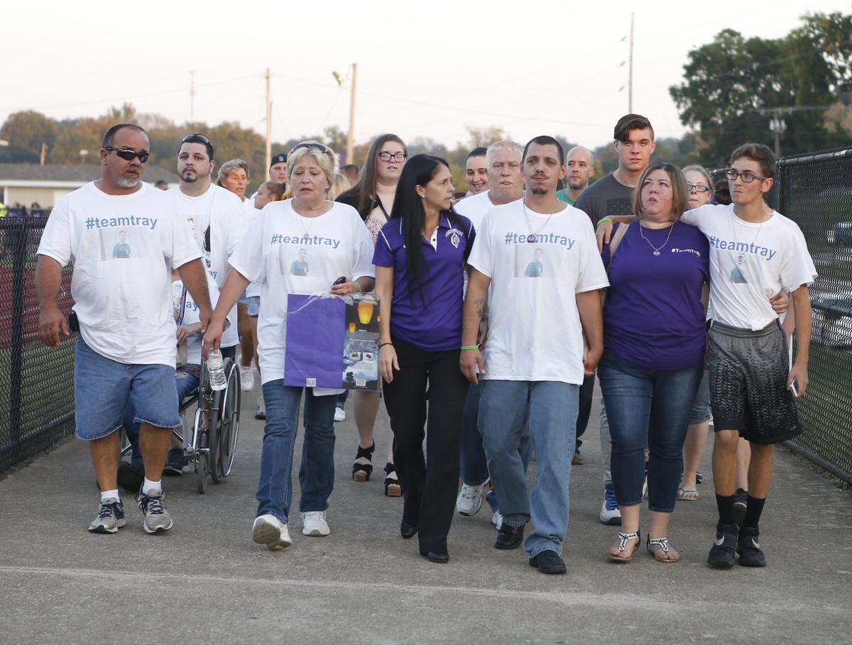 Tray Turner’s parents Joel and Heather Seib (on the right) were surrounded by family and friends as they made their way to the football field for Collinsville’s game against Granite City after their son died. Tray Turner, a freshman, died from his injuries three days after he fell down some stairs at Collinsville High School. Heather Seib was awarded $375,000 from the school district’s insurers.
