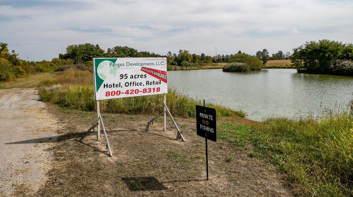 A large pond is part of a 95-acre parcel that’s being developed into mixed-use commercial southwest of the Interstate 55 and Illinois 143 interchange.