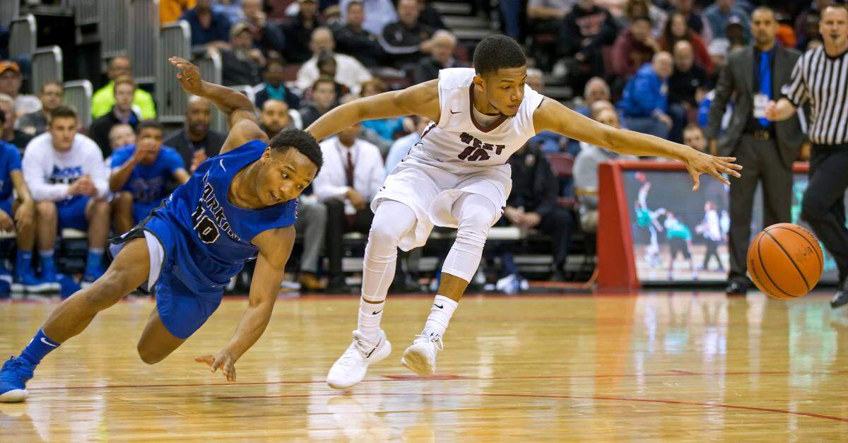 Belleville West's Lawrence Brazil III goes after the ball against Elgin Larkin's Kindrel Morris in Friday's IHSA Class 4A state semifinal game.