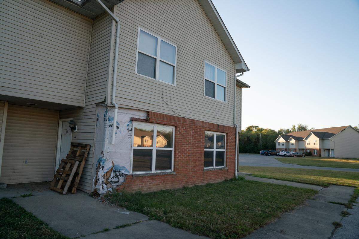 Exterior bricks fell off the side of one of the apartment buildings at Centreville Courts, exposing the protective barrier and wood frame underneath.