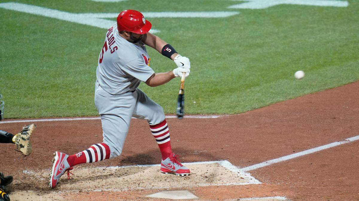 St. Louis Cardinals’ Albert Pujols hits career home run No. 703 during the sixth inning of a baseball game against the Pittsburgh Pirates, Monday, Oct. 3, 2022, in Pittsburgh. The Pirates won the game 3-2.