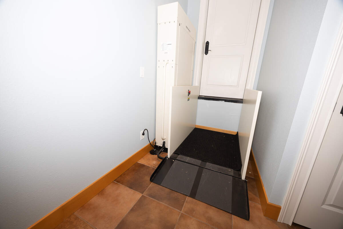 The guest bedroom also comes with accessibility features, including a master bedroom on the first floor and a wheelchair lift from the garage, pictured here.