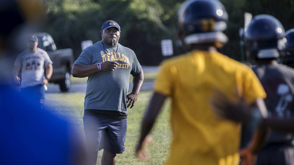 O’Fallon High School Panthers football coach Byron Gettis leads the Panthers through drills in this file photo.