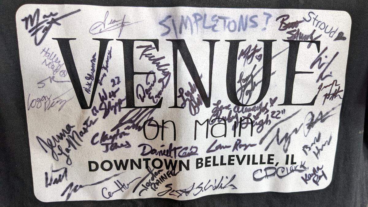 Close-up of a T-shirt signed by artists who performed at Venue on Main