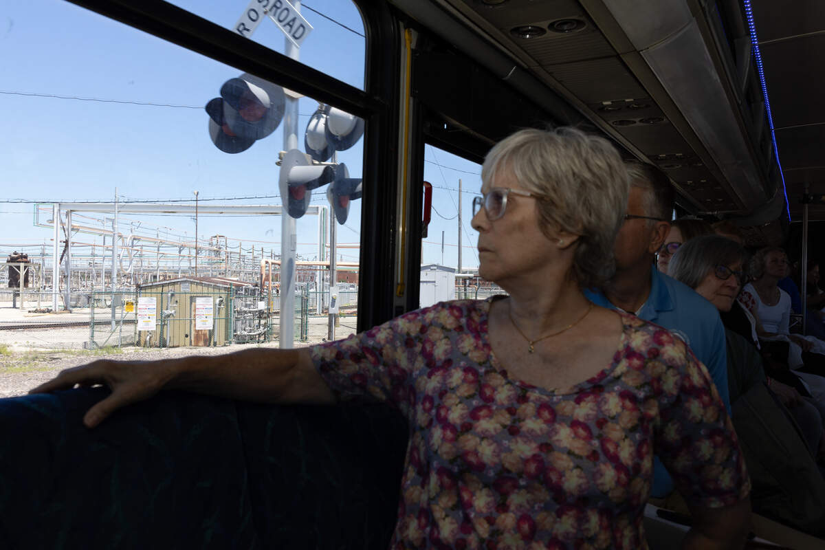 Residents and activists watch as the bus touring Illinois Environmental Protection Agency officials through the metro-east’s contaminated sites passes Veolia North America-Trade Waste Incineration, a hazardous waste incinerator in Sauget.
