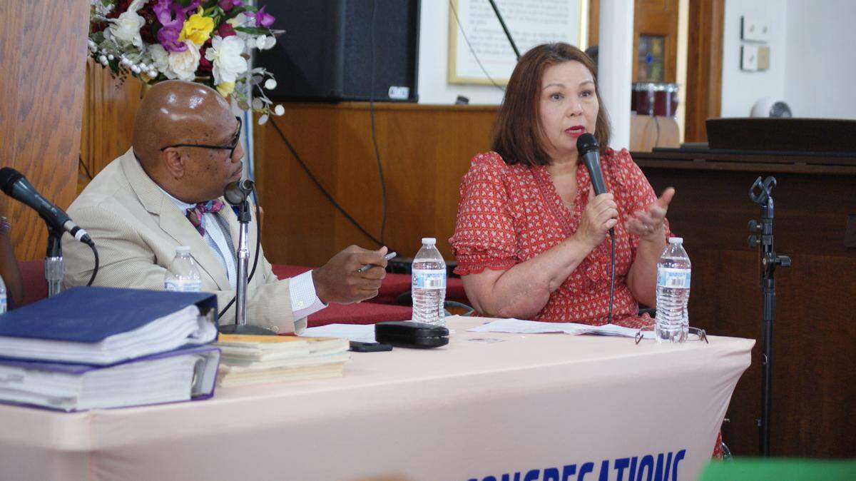 U.S. Sen. Tammy Duckworth, D-Illinois, speaks to environmental activists Saturday in East St. Louis as George McClellan, vice president of the NAACP East St. Louis Branch, watches her.