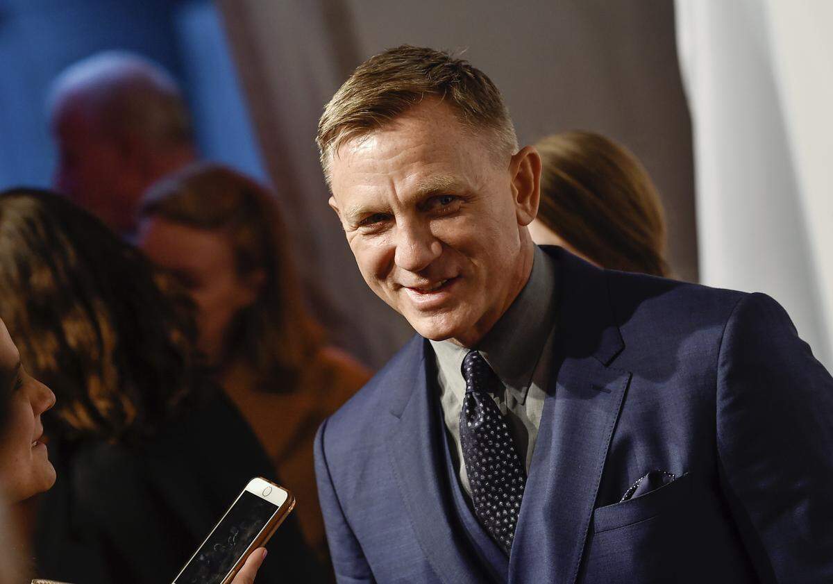 In this Monday, April 9, 2018, file photo, actor Daniel Craig attends The Opportunity Network’s 11th Annual Night of Opportunity Gala at Cipriani Wall Street in New York. After more than a decade at Sony Pictures, James Bond has a few new homes. In a joint announcement with their new partners Thursday, May 24, 2018, Michael G. Wilson and Barbara Broccoli said Universal Pictures will release the 25th installment of the superspy franchise internationally while MGM will release the film in the U.S. Craig will be reprising his role as 007 in the film and Oscar-winner Danny Boyle will direct.