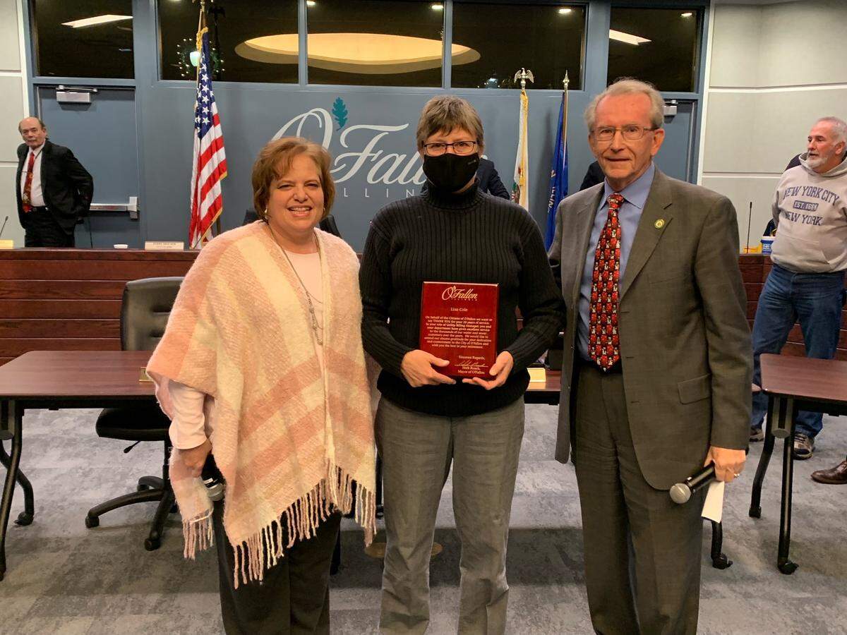 From left, Finance Director Sandy Evans, retiring water department manager Lisa Cole and Mayor Herb Roach. Cole was honored for her 28 years of service at the O’Fallon City Council’s most recent meeting.