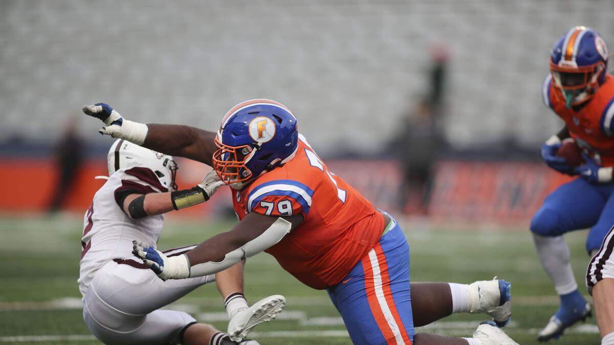 East St. Louis offensive lineman Terran Scarborough levels a Prairie Ridge defender during the IHSA Class 6A state championship game.