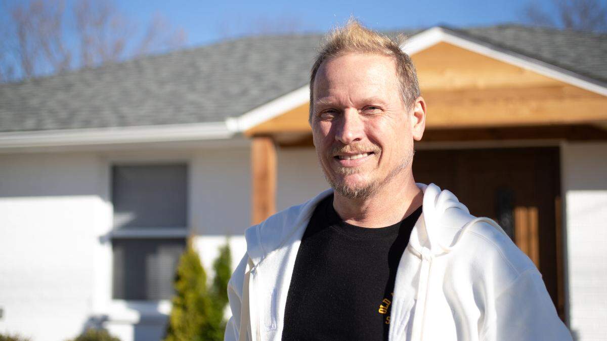 Riley Goodwin stands in front of his property in Marissa, Ill. on Nov. 20, 2024.