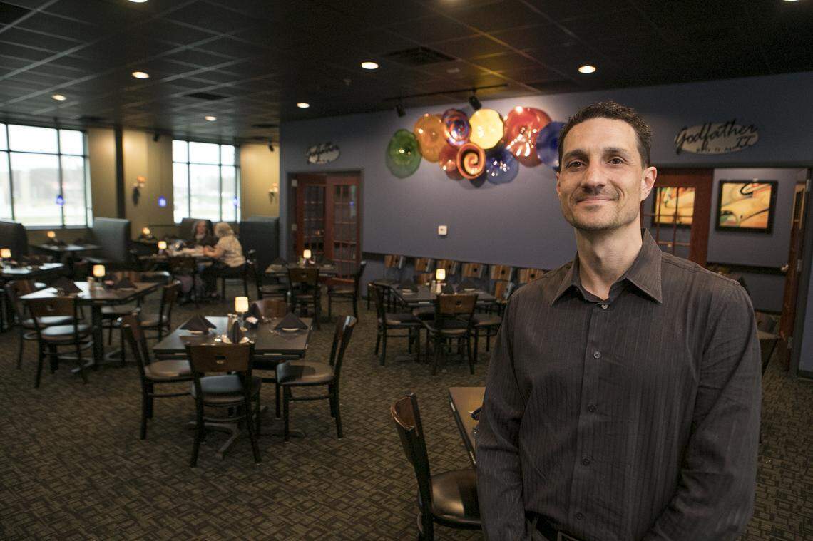 Tom Guarino, director of stores for Bella Milano Italian restaurants, poses in the main dining room at the O'Fallon location, which is just around the corner from the new St. Elizabeth's Hospital.
