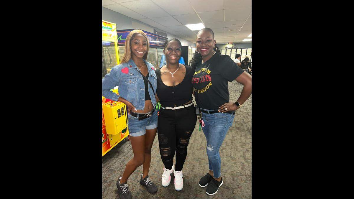From left to right, Tryphena Cason’s daughter Kyla, Cason’s “bonus daughter” Tra’Lia Winters and Tryphena Cason.