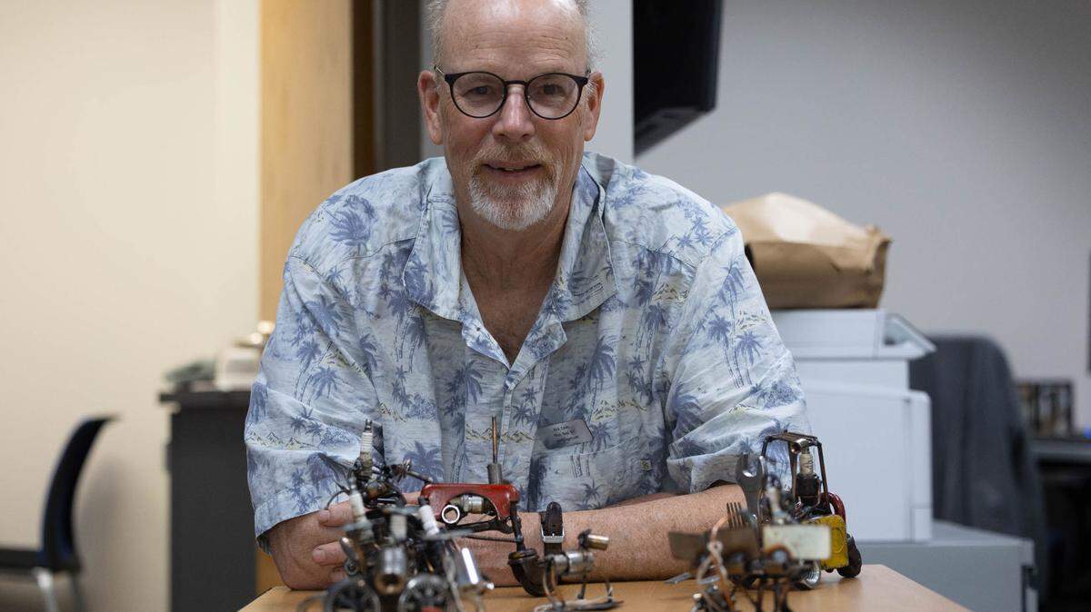 Dick Cooley, an artist from Wisconsin, traveled to the metro east for Art on the Square and to talk to students at The CAVE as part of the art show’s Artist in Residence program. Cooley has a long career in welding under his belt, and uses these skills to produce sculptures out of so-called junk. He’s known as the “Spark Plug Guy” as all of the people in his pieces are made of spark plugs.