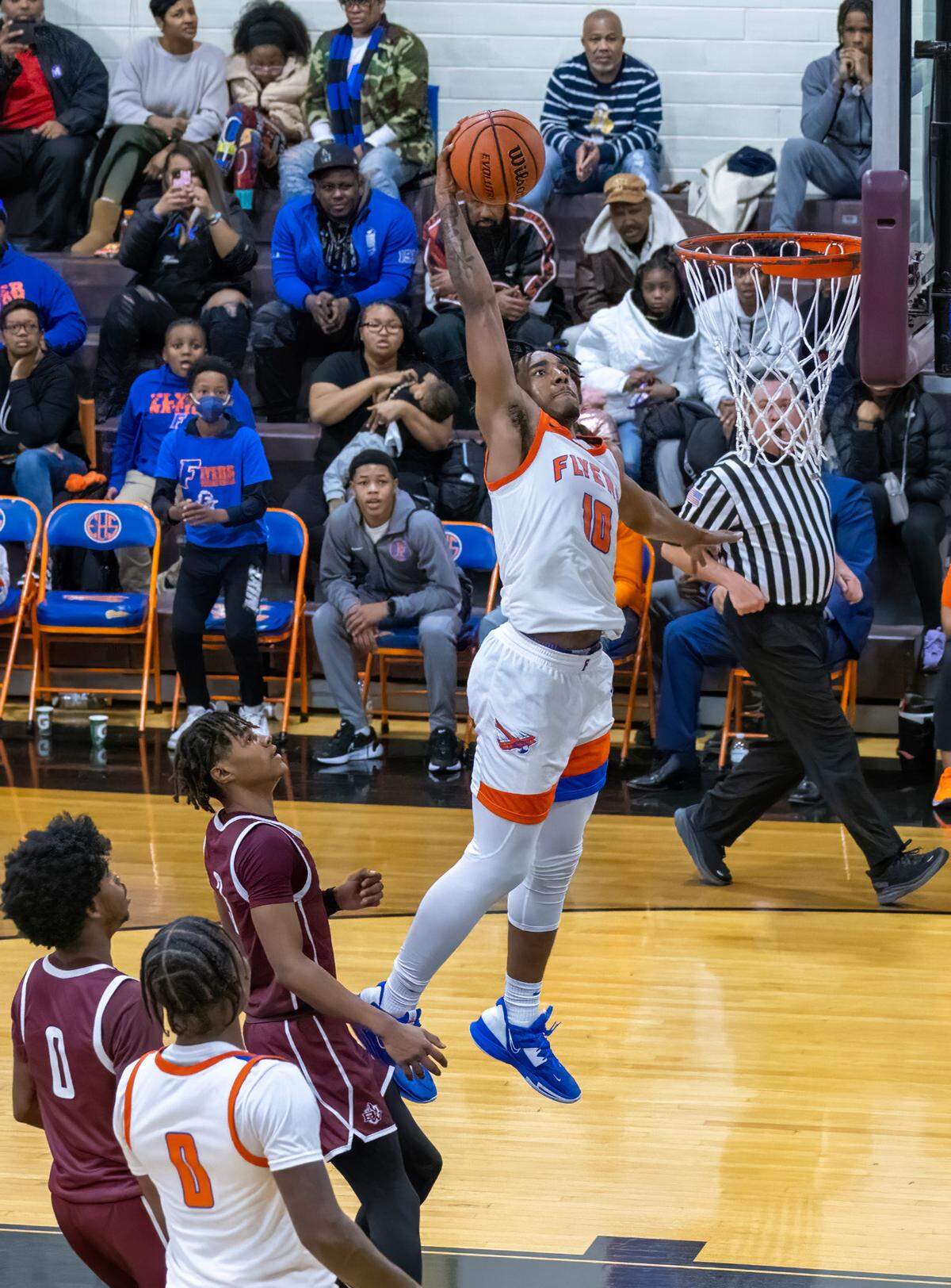 East St. Louis’ Antwan Robinson goes up for a dunk against Belleville West during Friday night’s Southwestern Conference game. The Flyers ultimately posted an 81-52 victory.