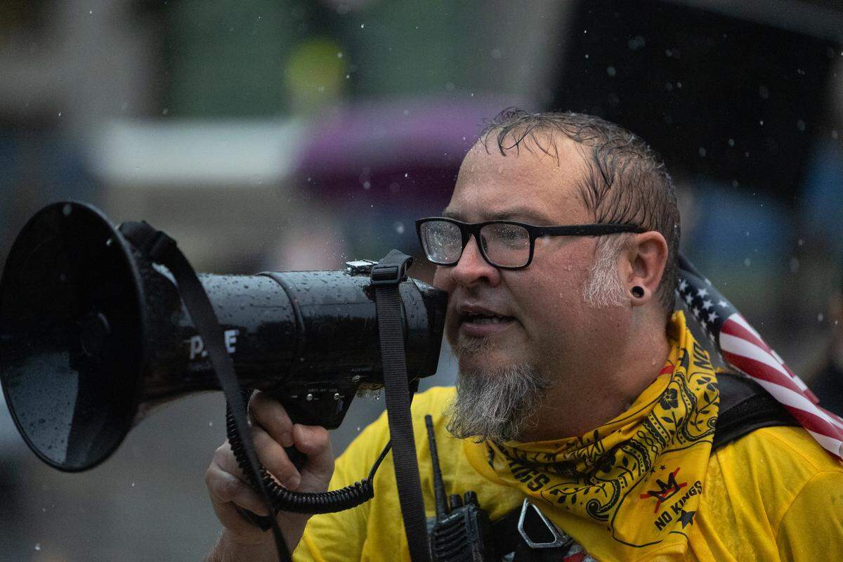 Local lawyer and protest organizer Alex Enyart announces the dismissal of the Belleville No Kings protest due to safety concerns associated with lightning Saturday. “We have to call it,” Enyart began, “or you can do whatever you want, it’s a free country.”