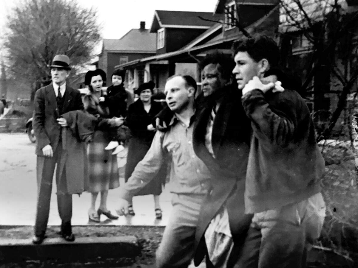 In 1938, volunteer rescue workers carry an injured woman along North 30th Street toward Main Street, Belleville. The volunteer in the dark jacket was Lincoln Luke. The identities of the other volunteer and injured woman were not recorded.