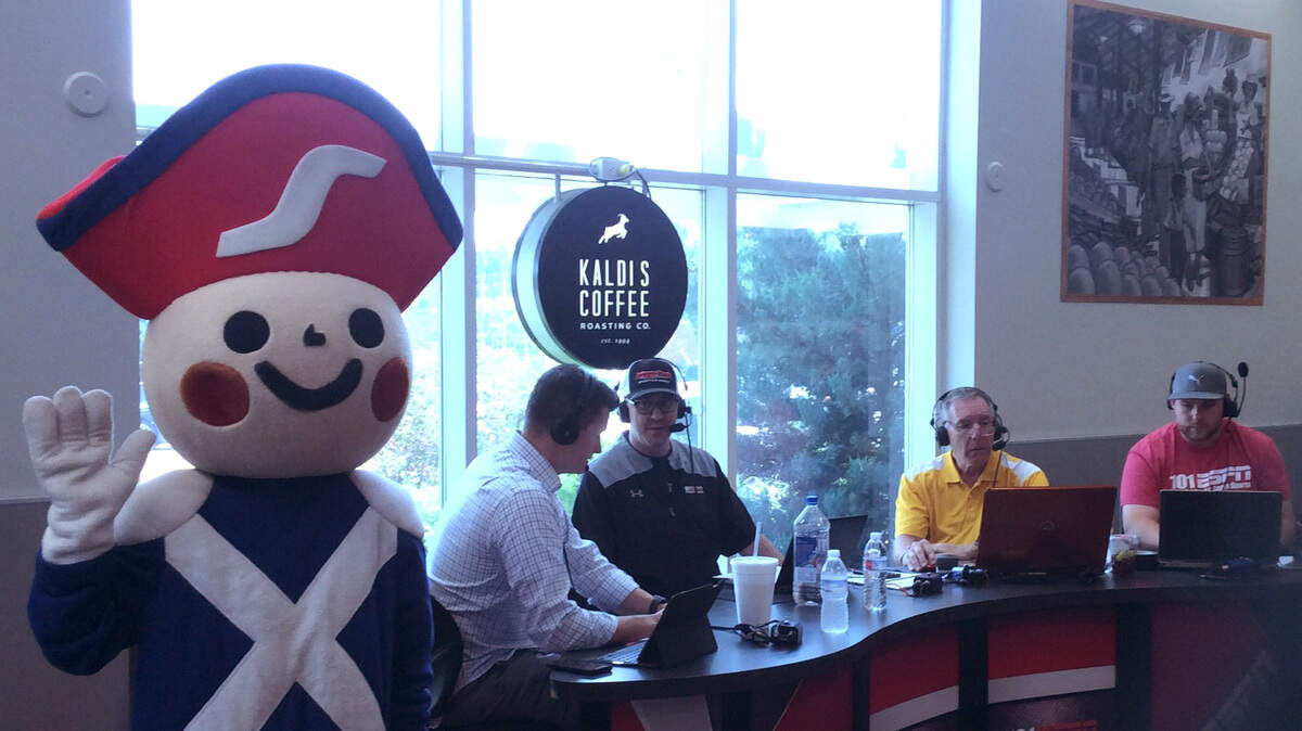 Schnucks Markets Inc. mascot, Henry the Soldier, and 101 ESPN: "The Fast Lane" radio live broadcast at the O'Fallon Schnucks Kaldi's Coffee Shop Friday, June 15 for the Folds of Honor military charity fundraiser at the 907 E. Hwy 50 location. "The Fast Lane" hosts pictured here include: Brad Thompson, Chris Rongney and Randy Karaker, as well as, a show producer.