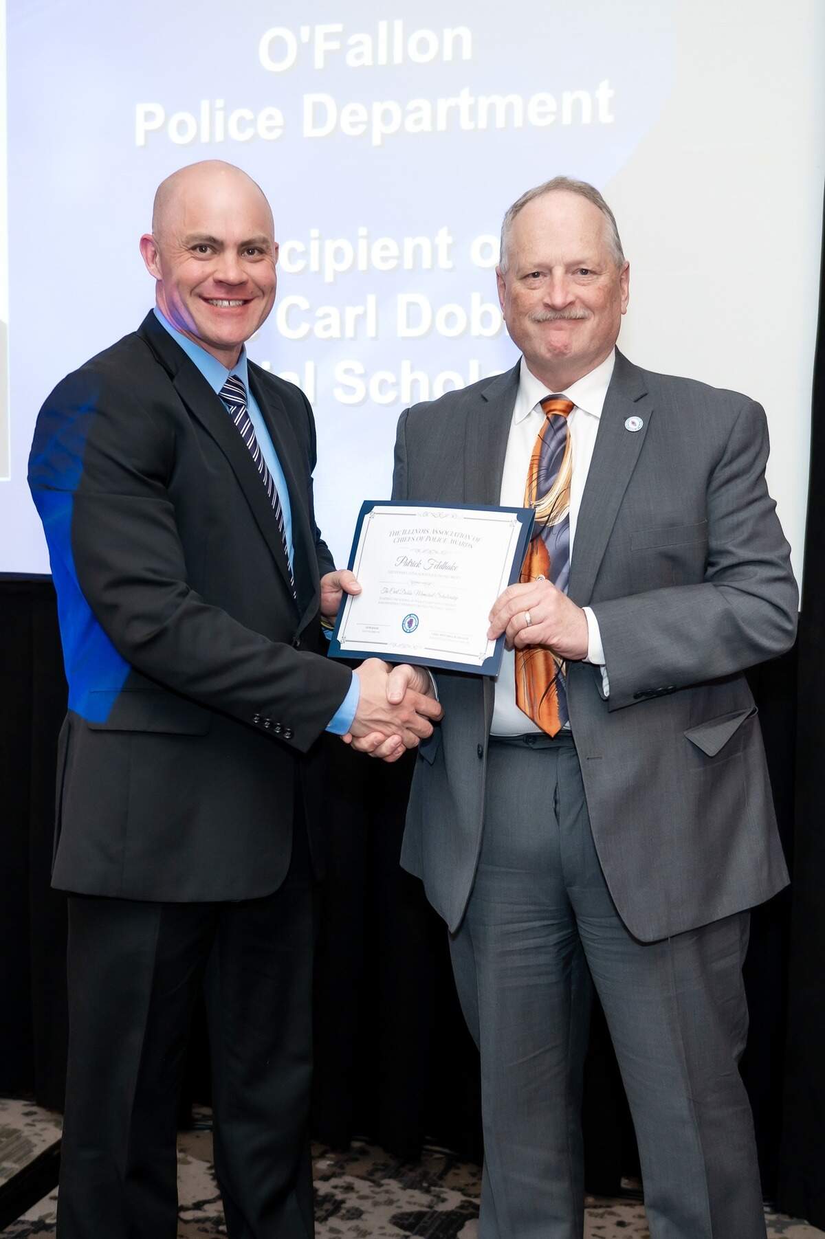 Lt. Patrick Feldhake of the O’Fallon Police Department, right, was selected as the 2022 recipient of the Carl Dobbs Memorial Scholarship, which the Illinois Association of Chiefs of Police gives annually to a command level officer in the state.