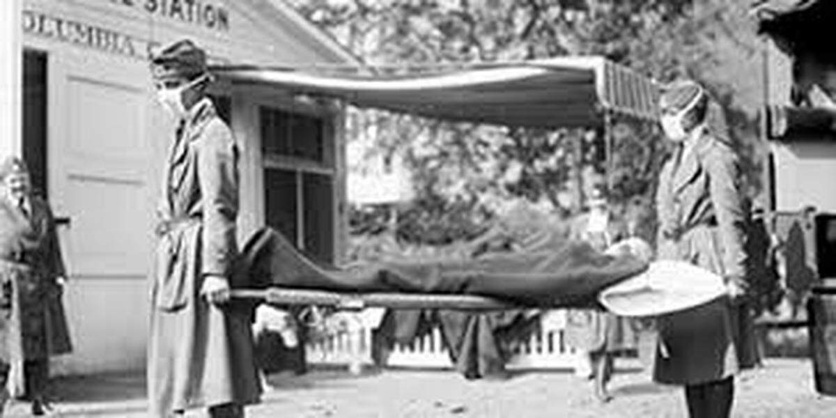 This photo from the U.S. Centers for Disease Control shows a victim of the 1918 influenza pandemic, which killed 50 million people worldwide, being carried on a stretcher.