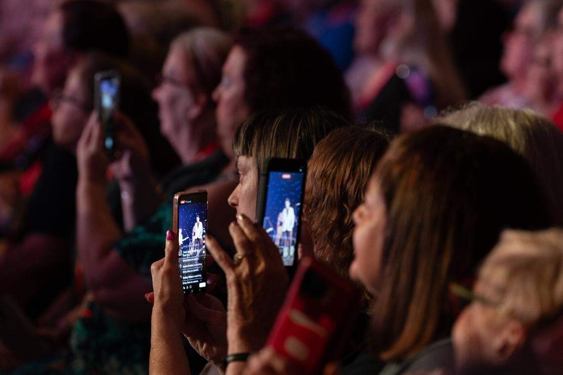 Elvis fans document Finely Watkins’s performance at the Gateway Convention Center as he croons through some of the 70s ballads.