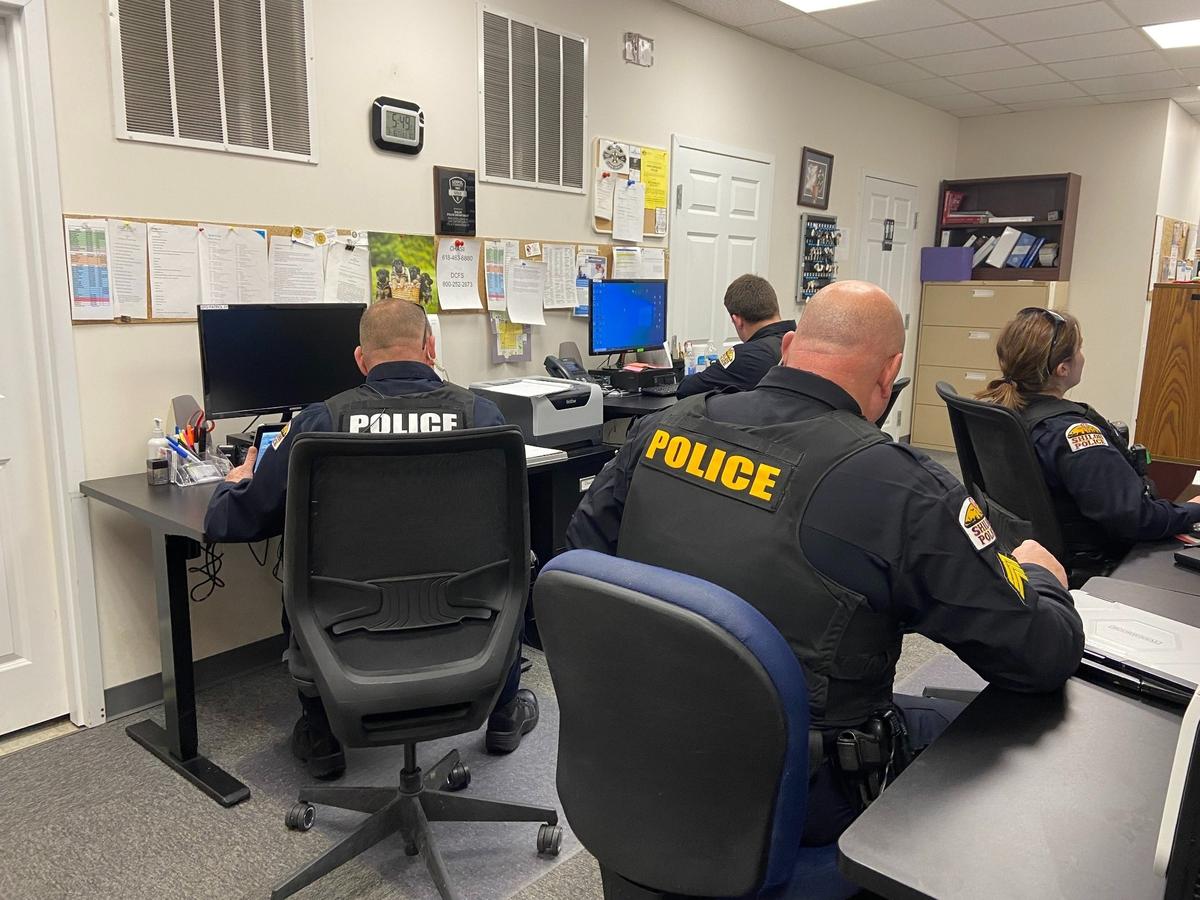 Shiloh police officers are seen here working in a crowded space. Funding a new station took a step forward when Mayor Robert Weilmuenster broke a 3-3 tie at the Shiloh Village Board meeting Monday. The approved resolution committed $1.2 million of the capital projects fund balance for the construction of a police station.
