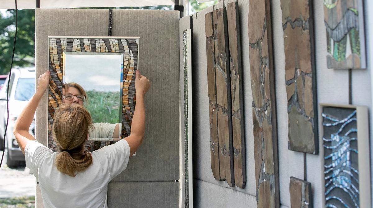 Mixed media and mosaic artist Peggy Schuning installs her art in preparation for this weekend’s Midwest Salute to the Arts in Fairview Heights. The 33rd annual Midwest Salute to the Arts takes place at Moody Park in Fairview Heights, starting Friday night, Aug. 26. This art festival has something for everyone, including art demonstrations by local artist groups, live music, food and beverage vendors, and, of course, art. The event takes place 6-9 p.m. Friday, Aug. 26; 10 a.m. to 7 p.m. Saturday, Aug. 27; and 11 a.m. to 5 p.m. Sunday, Aug. 28.
