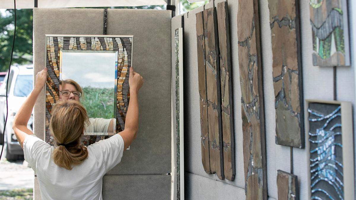 Mixed media and mosaic artist Peggy Schuning installs her art in preparation for this weekend’s Midwest Salute to the Arts in Fairview Heights. The 33rd annual Midwest Salute to the Arts takes place at Moody Park in Fairview Heights, starting Friday night. This art festival has something for everyone, including art demonstrations by local artist groups, live music, food and beverage vendors, and, of course, art. The event takes place 6-9 p.m. Friday, 10 a.m. to 7 p.m. Saturday, and 11 a.m. to 5 p.m. Sunday.
