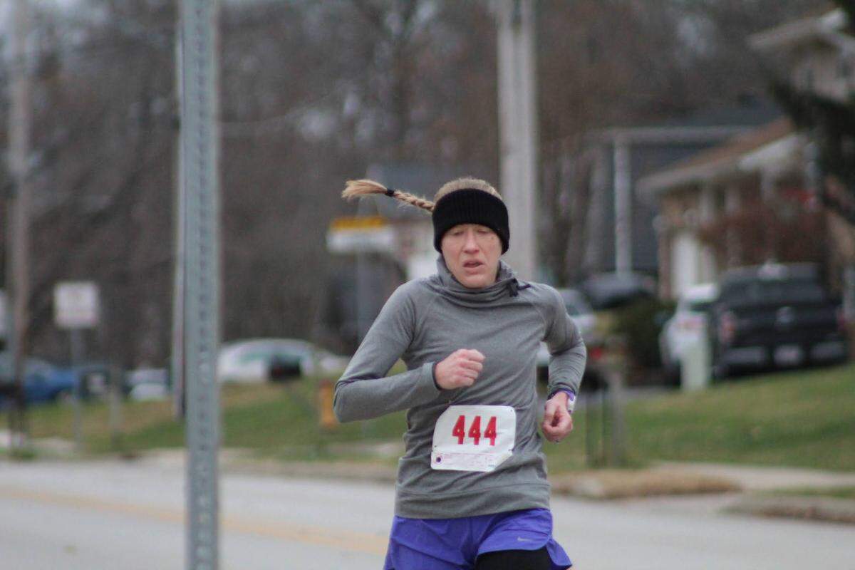 A runner participates in the annual Holiday Hilltop 5K Run/Walk in Shiloh. Event Director Neil Jansen said over $280,000 has been raised during the past 10 years to benefit a young person battling a challenging medical condition.