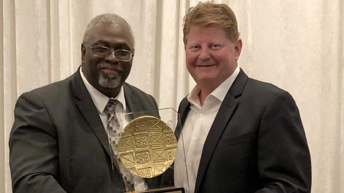 Illinois Black Chamber of Commerce President and CEO Larry Ivory presented Illinois American Water’s President Bruce Hauk and Illinois American Water with the Corporate Leadership Award for the company’s efforts in diversity and inclusion. Roger Goodson, senior manager of field services and production, accepted the honor.