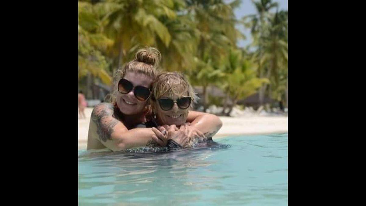 Courtney Tomlinson and her mother, Susanne Tomlinson, both of Troy, are pictured on vacation last summer in the Dominican Republic. Courtney Tomlinson says her boyfriend set her mother on fire, killing her and destroying the duplex where she lived.