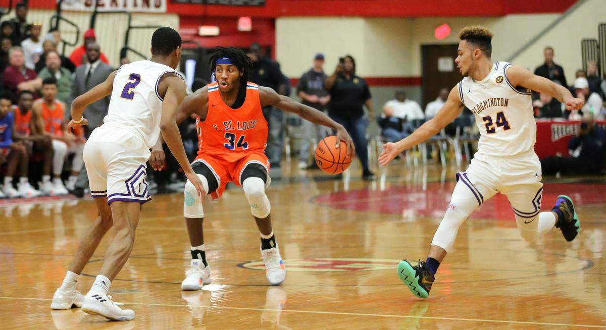 East St. Louis Terrance Hargrove brings the ball up court during the Highland Scott Credit Union/Optimists Shootout Saturday.