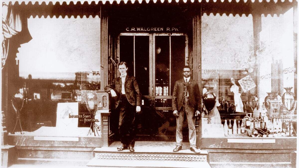 Pictured in front of Walgreens’ first drugstore, circa 1901, is store handyman Caleb Danner, right, and an unidentified man on the left. The store was located at 4134 Cottage Grove Ave. in Chicago.