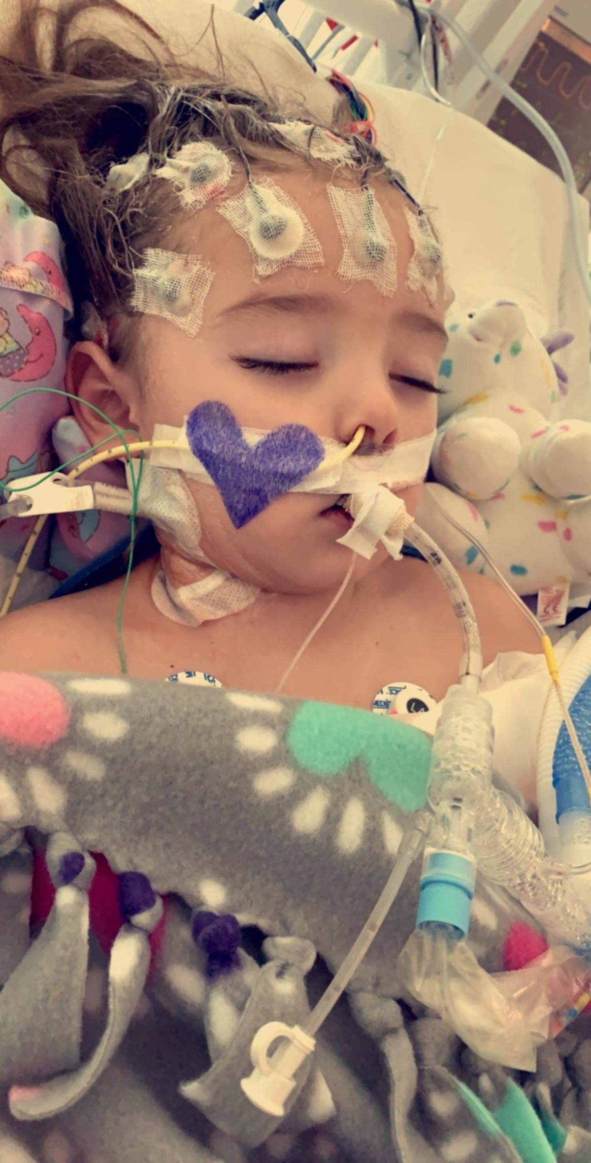 Two-year-old Layla Thomas is unresponsive at St. Louis Children’s Hospital. She has been diagnosed with necrotic encephalitis (inflammation of brain).