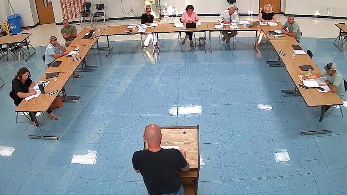Freeburg school board members listen to a speaker at their videotaped meeting on Aug. 26. They later went into closed session to discuss asking St. Clair County Regional Office of Education Superintendent Lori Costello to remove one member from office.