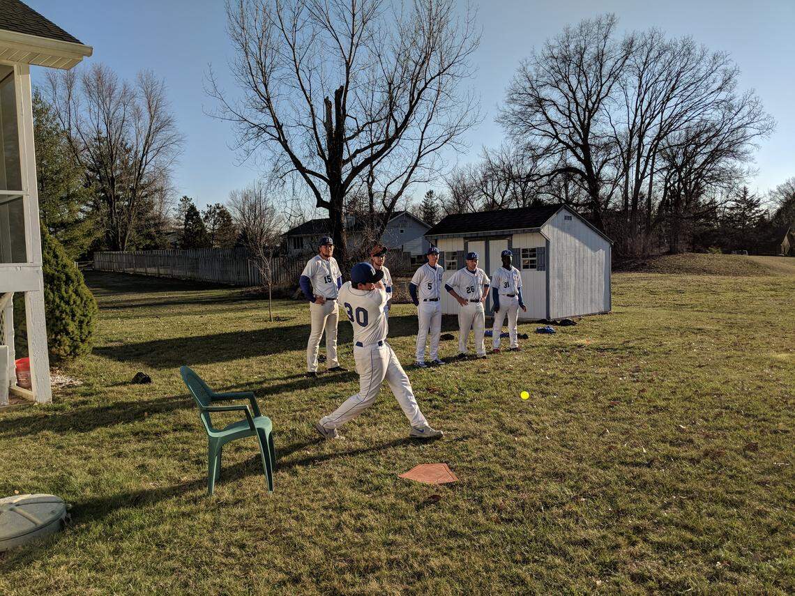 A member of the Lewis and Clark College baseball team gets a hit during a game played in the backyard of Marilyn Seavers, the grandmother of Trailblazers' pitcher Zach Seavers.
