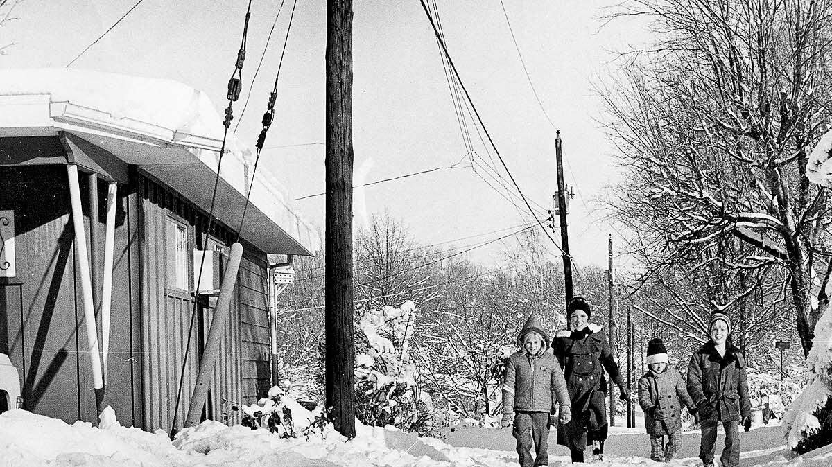 Children make their way through a Belleville alley after a storm dumped up to 18 inches of snow on Belleville the weekend of Jan. 30-31, 1982.