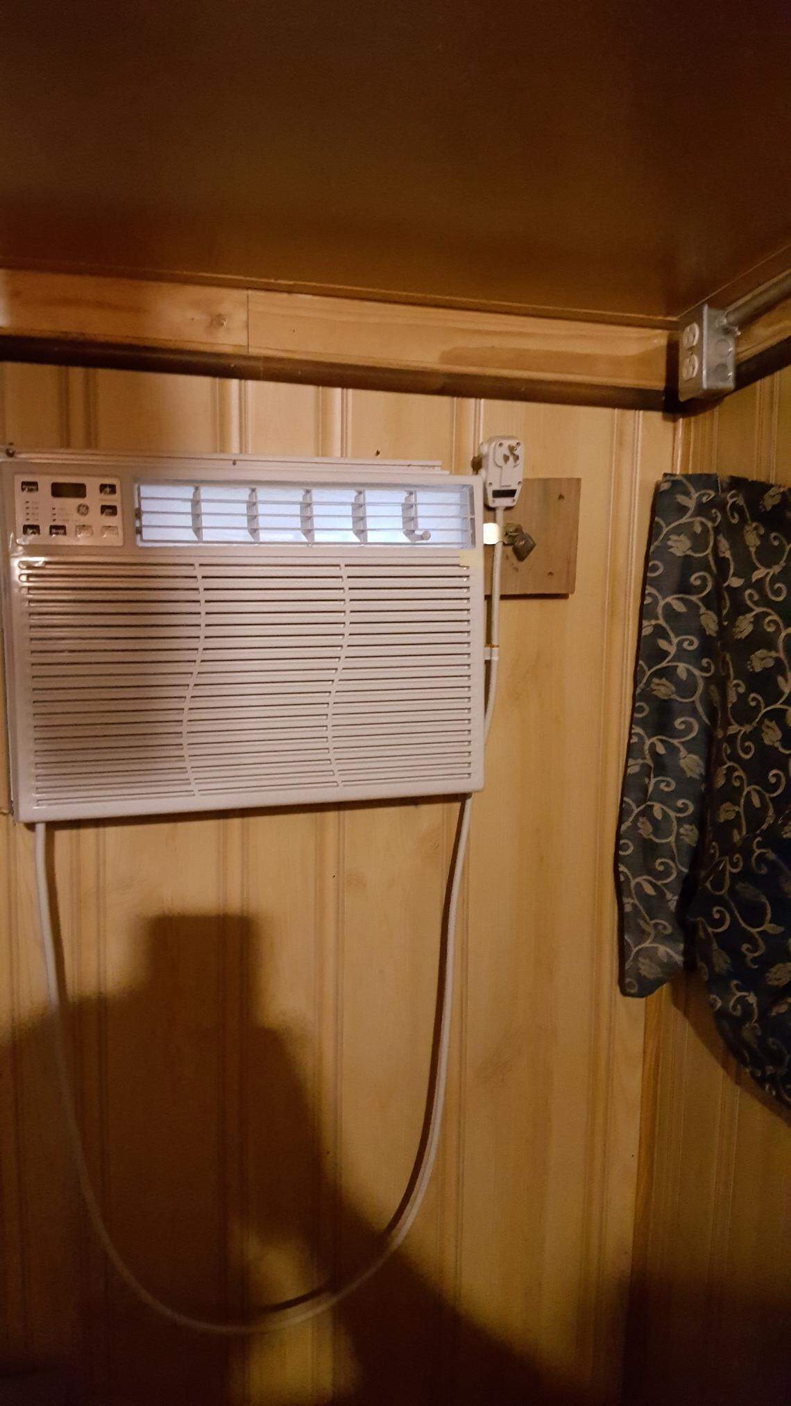 Anthony LeFlore, Alorton’s code enforcer, said he took this photo at 40 Jarvis during a 2017 inspection. It appears to show an air conditioner unplugged with the chord padlocked to the wall.