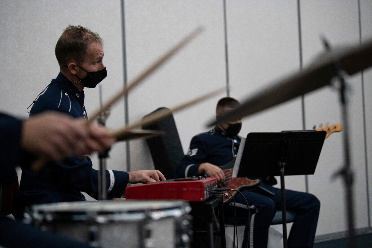 Members of the U.S. Air Force Band of Mid-America play cover songs during an official ceremony in the Heritage Event Center at Scott Air Force Base. Starlifter and other smaller subsets of BoMA are requested to play music at various venues from sporting events to changes of commands to connect with the audience through their musical talents.